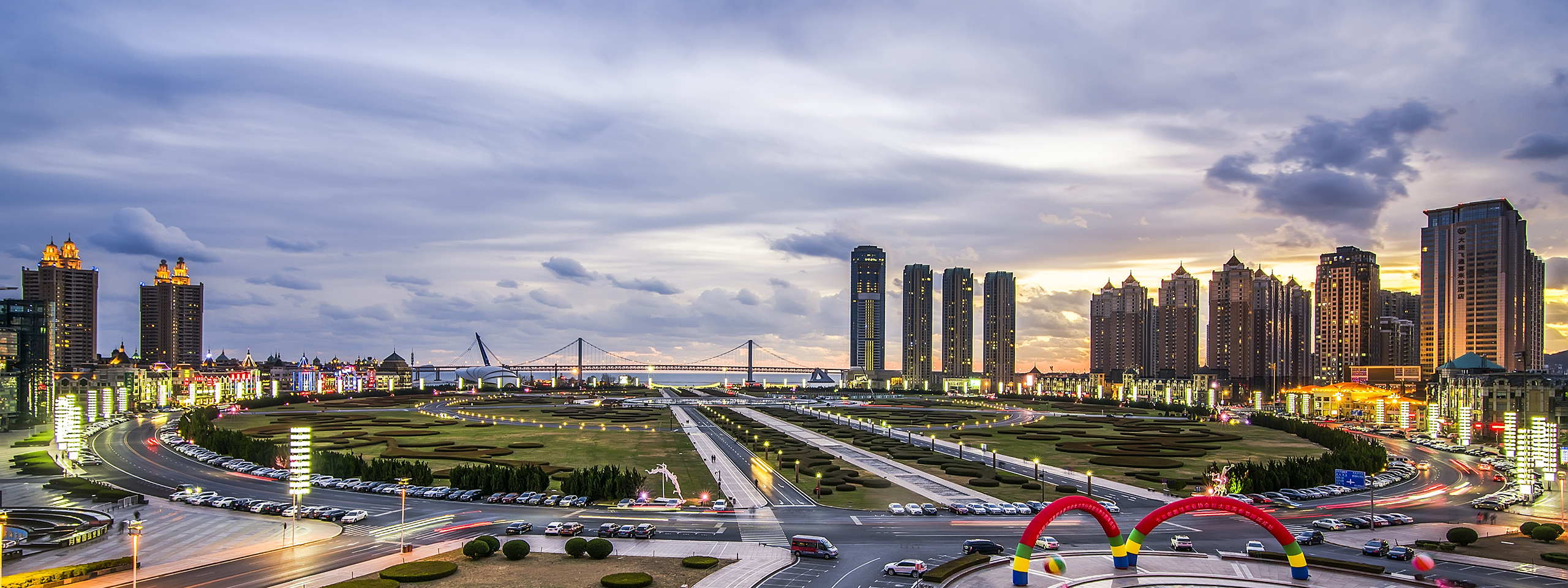 Dalian city boulevard and bridge at dusk