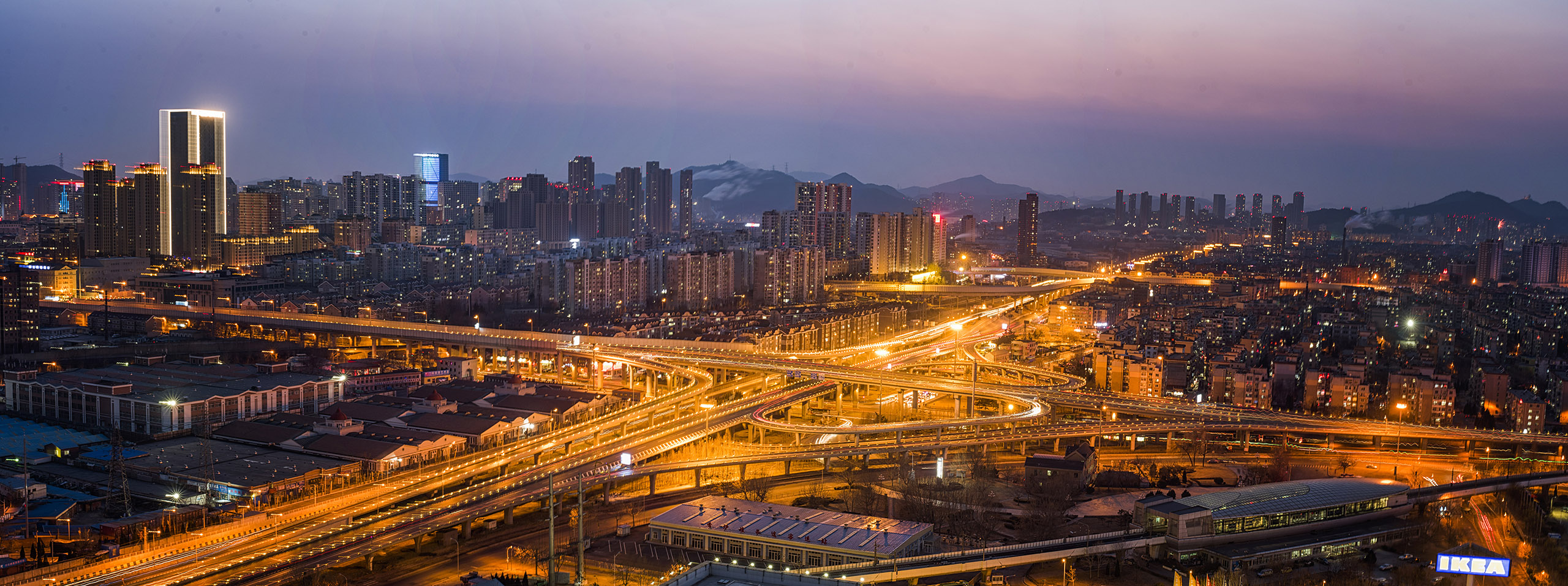 Dalian city expressways and skyline at night